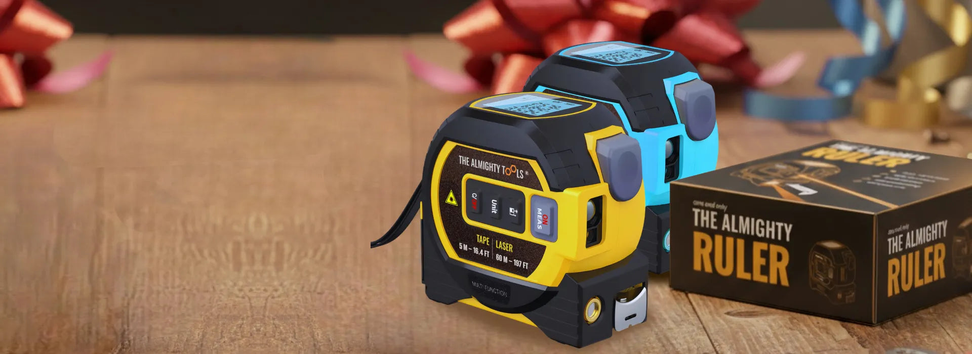 Two tape measures and a box labeled 'The Almighty Ruler' on a wooden surface with decorative ribbons.