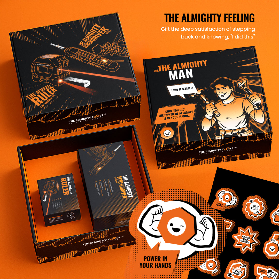 The Almighty Gift Box tool set with screwdriver, ruler, vibrant orange packaging, and stickers